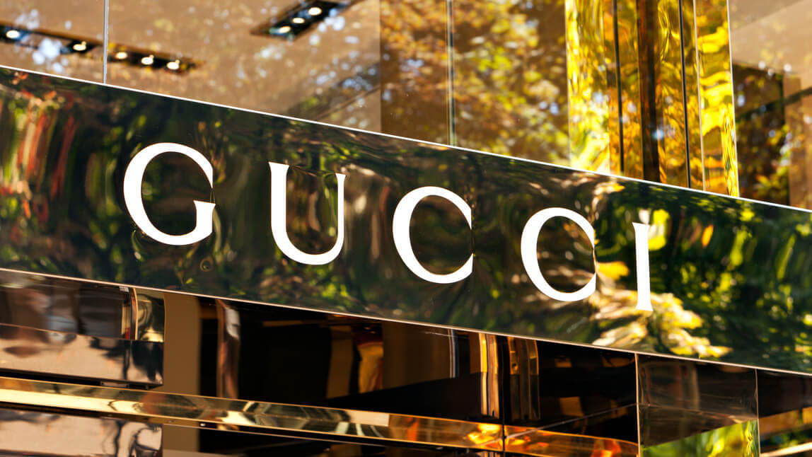 Gucci sign in shop window.
