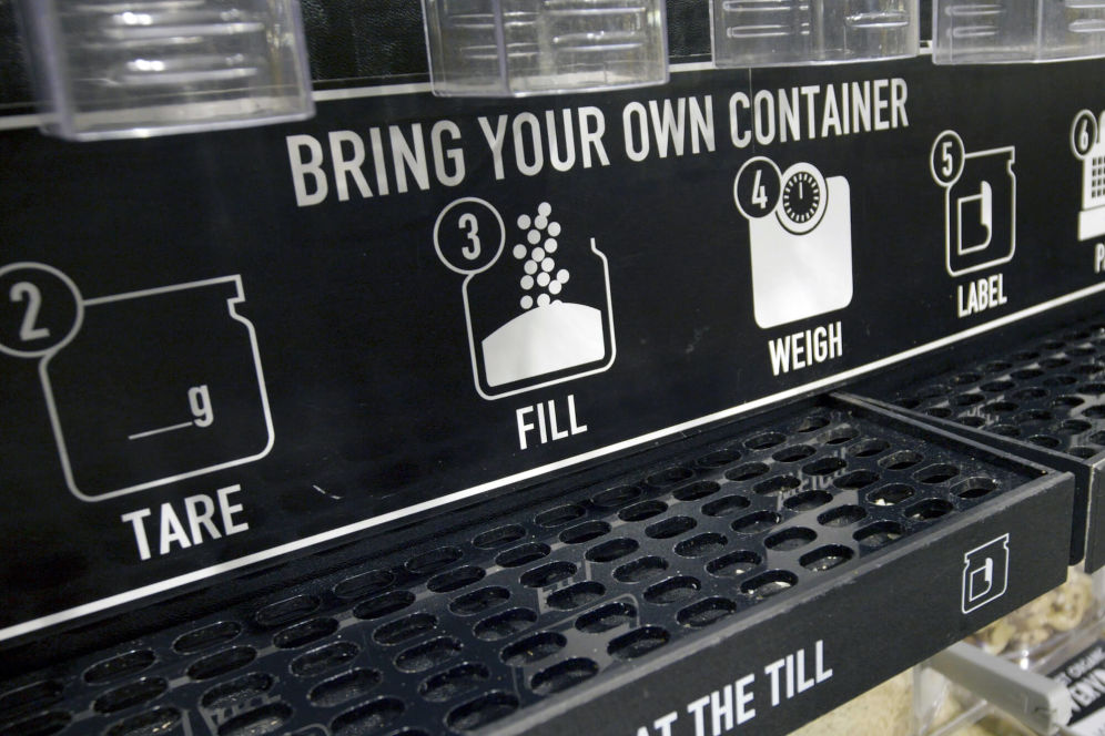 Machine with diagrams showing how to bring your own container 