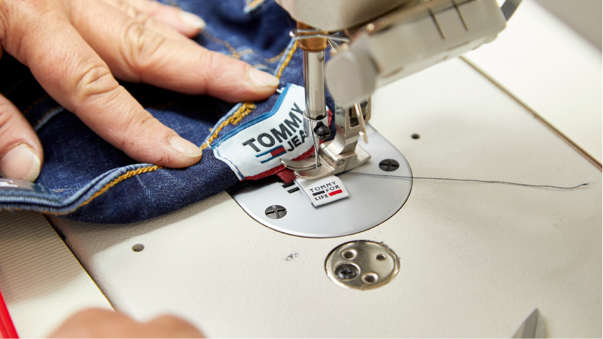 Person sewing jeans