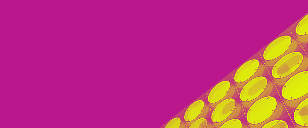 Abstract image of yellow dots on a pink background. 