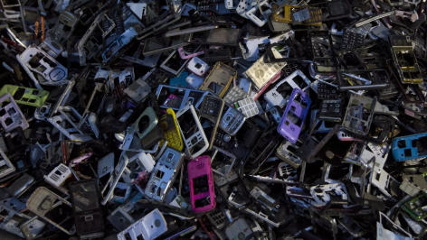 Pile of old broken mobile phones